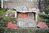 Kangra Valley - carved stones along the ritual path that encircle the Tsuglagkhang, official residence of the Dalai Lama